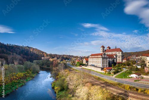 Aerial shot of Bazylika Nawiedzenia NMP in Bardo, Poland, autumn 2022, view from above the Nysa Klodzka river. 