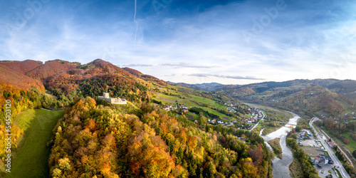 Fototapeta Naklejka Na Ścianę i Meble -  Rytro Castle in autumn, Poprad river valley, Poland, aerial drone panoramic shot.