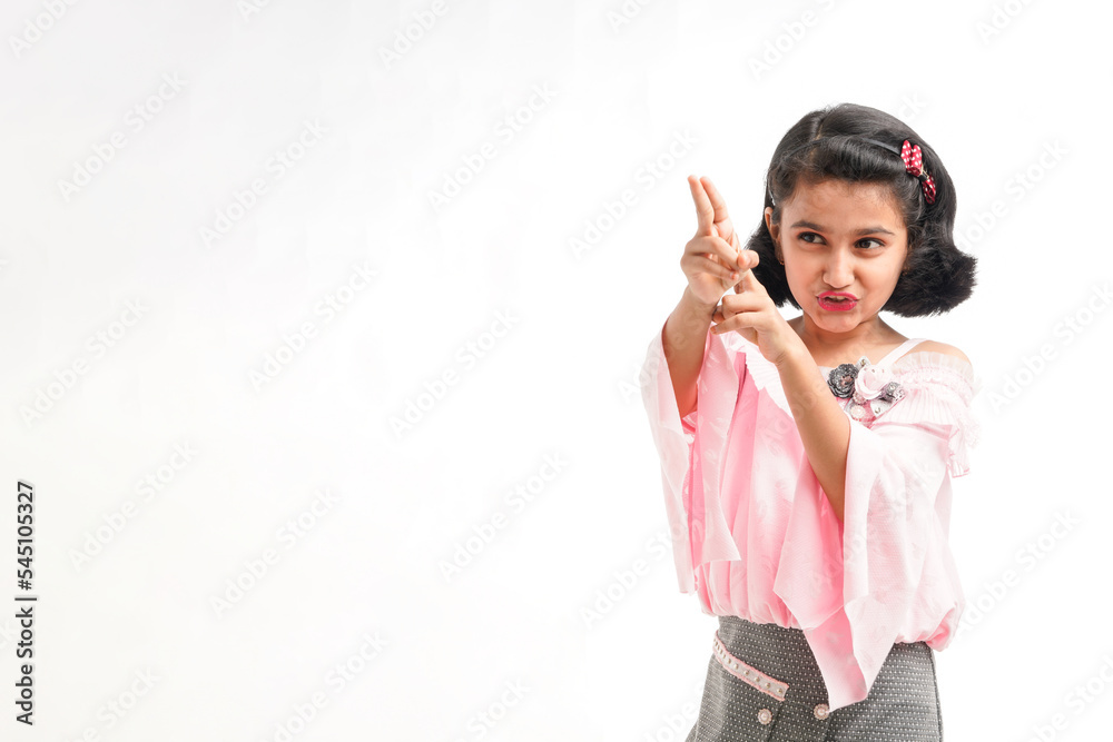 Cute indian little girl giving expression on white background Cute indian little girl giving expression on white background