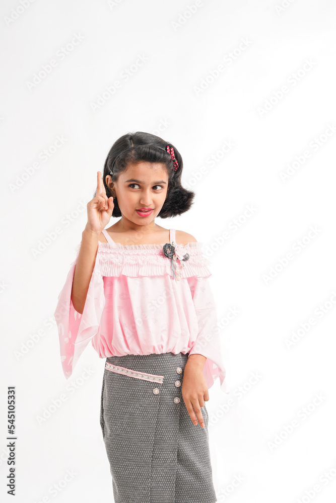 Cute indian little girl giving expression on white background Cute indian little girl giving expression on white background