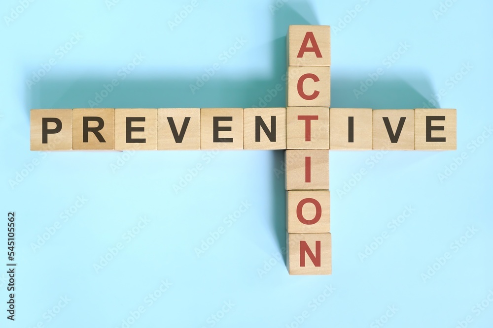 Preventive action business concept Wooden blocks crossword puzzle flat Preventive action business concept Wooden blocks crossword puzzle flat