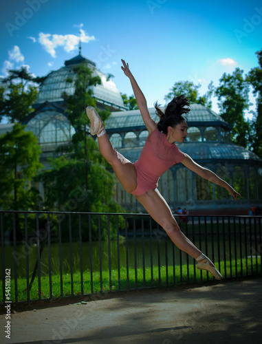 Beautiful ballerina dancing outdoors with body color cloth. She danced on ballet pointe shoes. 