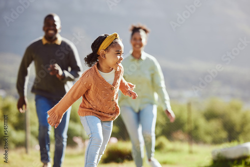 Black family, fun child and parents running, chasing and enjoy bonding quality time with youth kid on countryside vacation. Love, peace and freedom for happy girl, father and mother playing outdoor