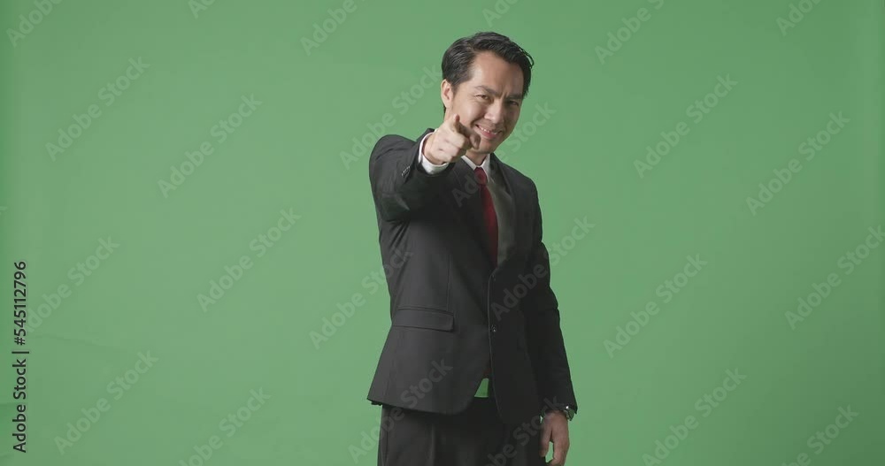 An Asian Business Man Smiling And Making Honest Gesture On Green Screen Background In The Studio
An Asian Business Man Smiling And Making Honest Gesture On Green Screen Background In The Studio