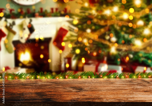 Empty wood table top on blurry bokeh Christmas tree and news year decoration. Concept Christmas time for web banner , display or montage your products.