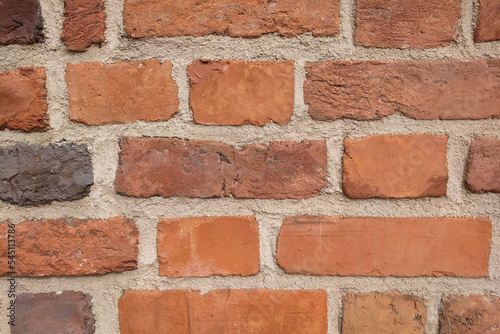 A structured brick wall of a house or building. Background.