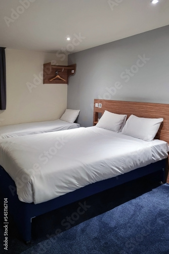 Bedroom with large and comfortable bed. Home interior.