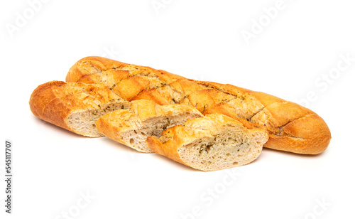 Freshly baked crispy French bread baguette with garlic butter and herbs isolated on a white background