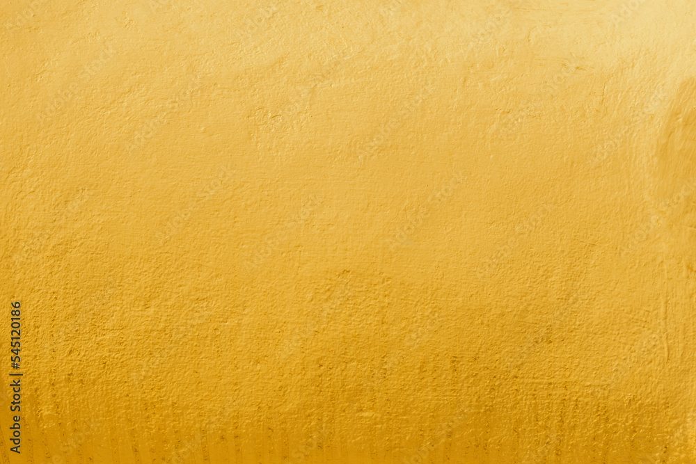 Gold wall texture background. Yellow shiny gold foil paint on wall sheet with gloss light reflection, vibrant golden luxury wallpaper Gold wall texture background. Yellow shiny gold foil paint on wall sheet with gloss light reflection, vibrant golden luxury wallpaper