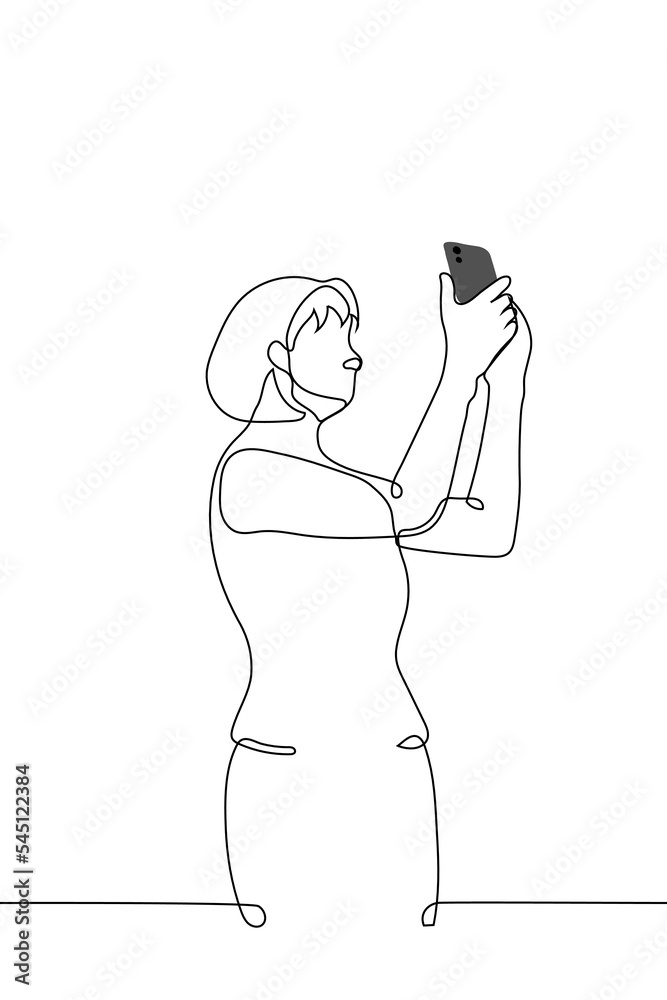 woman standing holding phone in her hands - one line drawing vector. the concept of taking a photo or trying to catch a communication signal woman standing holding phone in her hands - one line drawing vector. the concept of taking a photo or trying to catch a communication signal