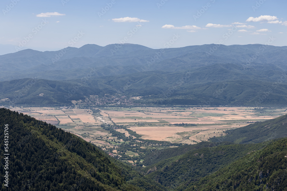 Aerial panoramic view from the Balkans on the valley of the Tundzha River which stretches from west to east and is known as famous Rose Valley, and mountain massif Srednaya Gora behind it, Bulgaria
