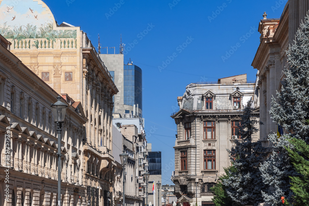 Buildings on Strada Ion Ghica are eclectic but tending to neoclassical architectural style, big bank offices, prestigious hotels and souvenir shops are mainly concentrated herе, Bucharest, Romania