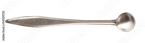 Small antique metal spoon isolated on white background.