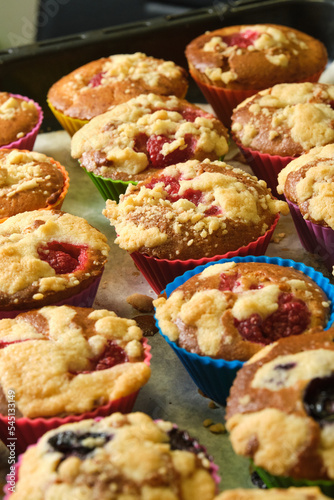 freshly baked muffins with berries