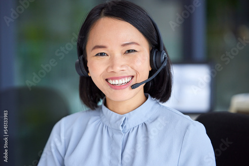 Portrait, call center and Asian woman for customer support, conversation and talking with smile, in office or happy. Client service, female agent and headset for telemarketing, speaking or consultant