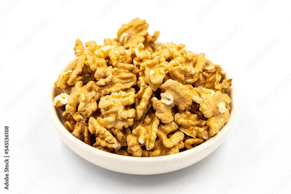 Walnut kernel. Walnuts in bowl on a white background. close up Walnut kernel. Walnuts in bowl on a white background. close up