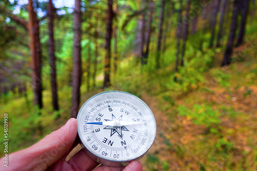 The right compass is always needed for travelers, adequate course. Hiking on coastal coniferous forests of Lake Baikal in Siberia photo