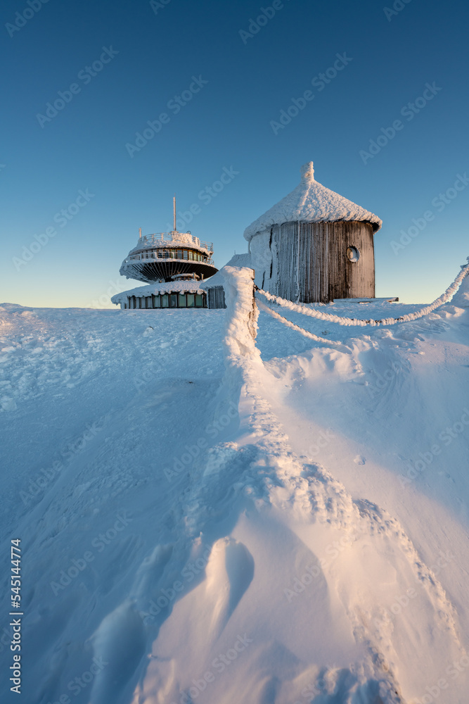 peak of Sniezka mountains during winter sunrise in Poland and Czech republic border in Giant mountains