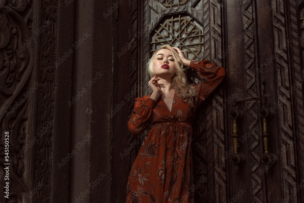 Young blonde woman in autumn city Young blonde woman in autumn city