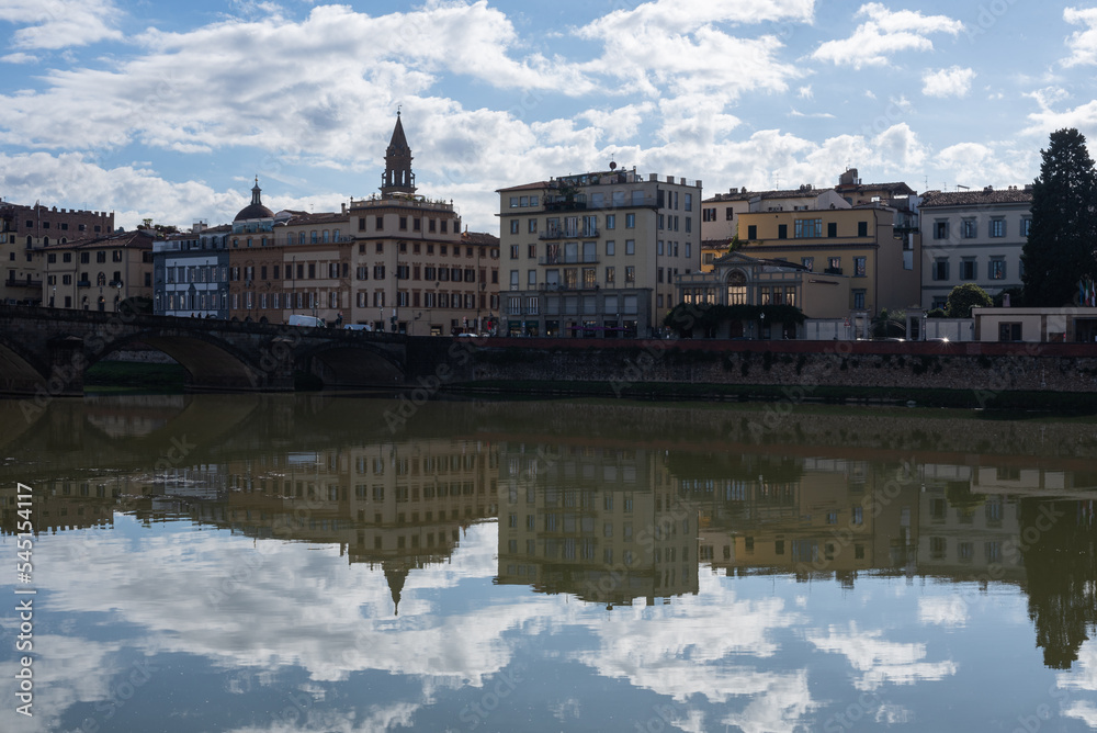 Bank of the river Arno in Florence, Italy. Buildings. Reflection. Panorama. Bank of the river Arno in Florence, Italy. Buildings. Reflection. Panorama.
