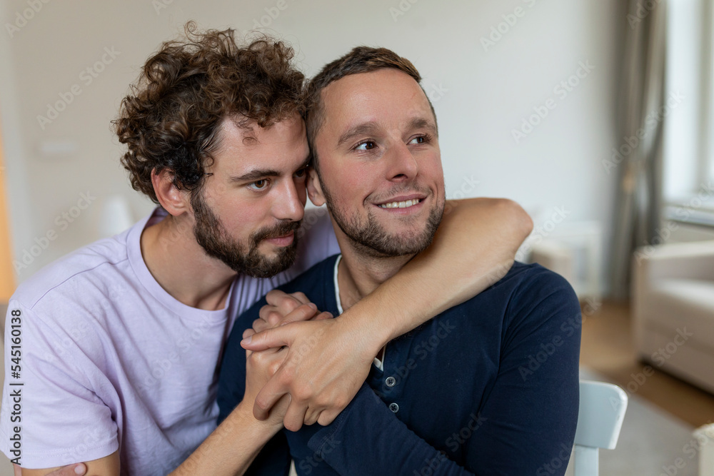Fototapeta premium Two young man lgbtq gay couple dating in love hugging enjoying intimate tender sensual moment together kissing with eyes closed