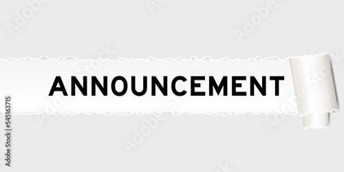 Ripped gray paper background that have word announcement under torn part
