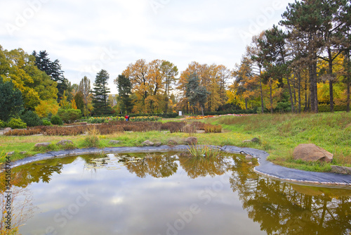 Picturesque autumn landscape with lake in Hryshka National Botanical Garden of the National Academy of Sciences of Ukraine in Kyiv 