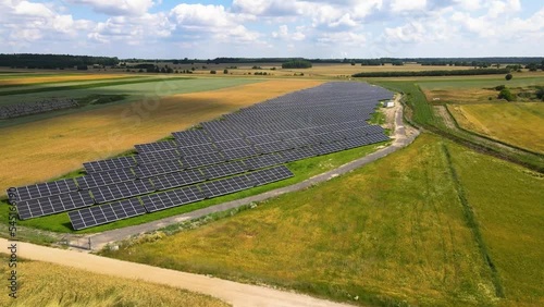 Aerial view, massive Solar panel farm on the field, alternative energy