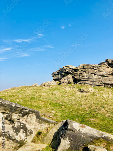 Portrait or vertical shot of Almscliffe Crag a millstone grit outcrop in North Yorkshire photo