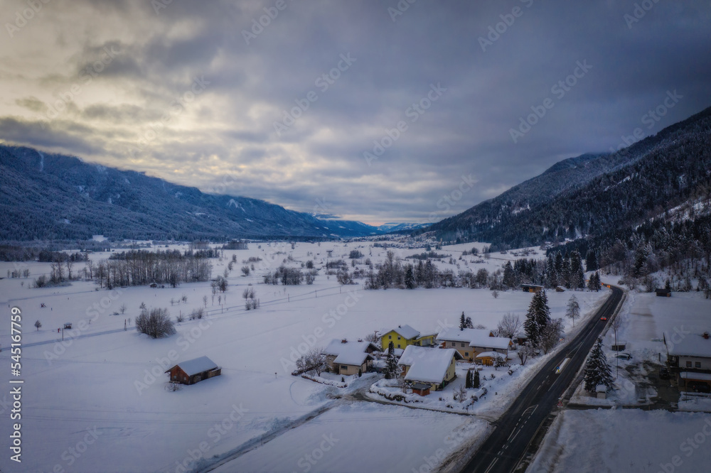 Panoramic view of the top of Waidegg near Tressdorf on the border between Italy and Austria. Nassfeld ski resort in 5km. January 2022, drone aerial shot.