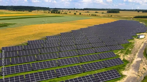 Aerial view, massive Solar panel farm on the field, alternative energy