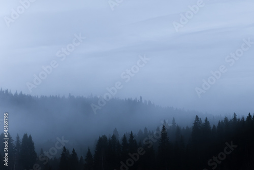 Beautiful mountain scenery with mountain covered in fog