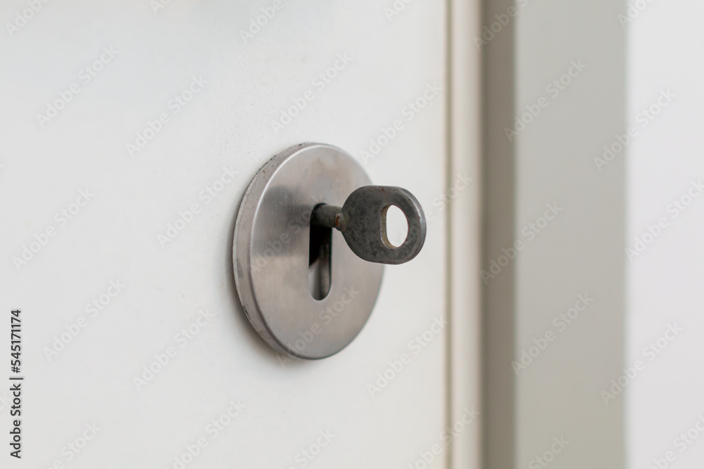 Inserted key in to the bathrooms lock Inserted key in to the bathrooms lock