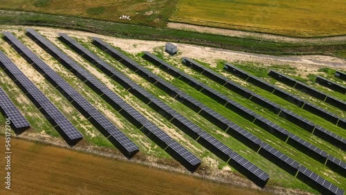 Aerial view, massive Solar panel farm on the field, alternative energy