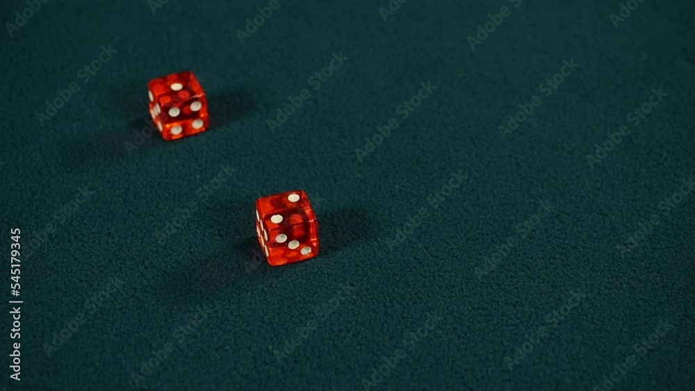 Two red dice roll two and one on green casino gaming table, Craps, Slow motion Two red dice roll two and one on green casino gaming table, Craps, Slow motion