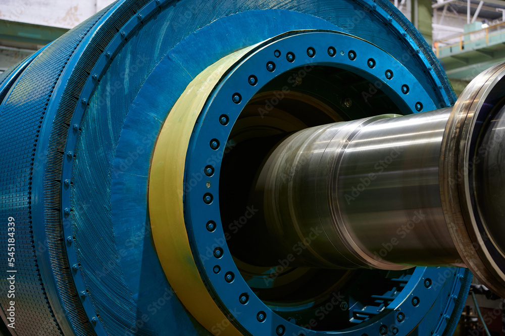 Blue ball mill grinds mineral materials at factory closeup Blue ball mill grinds mineral materials at factory closeup