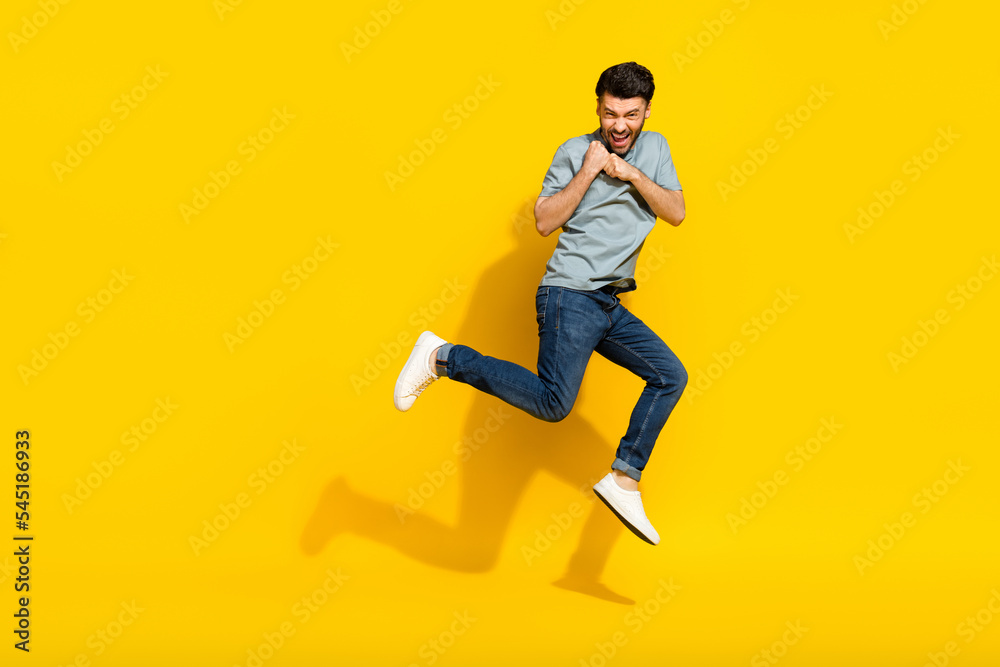 Full length photo of overjoyed man wear trendy clothes hold empty space black friday shopping sale isolated on yellow color background