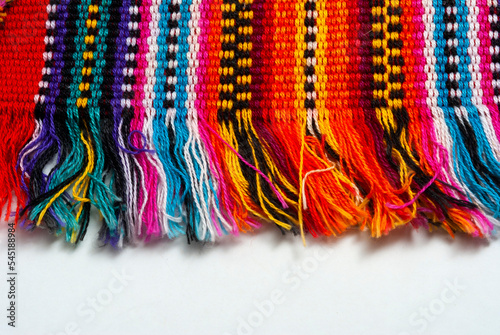 Detail of handmade textile by Mayan Indians in Guatemala, colorful cotton, ancestral cosmology.