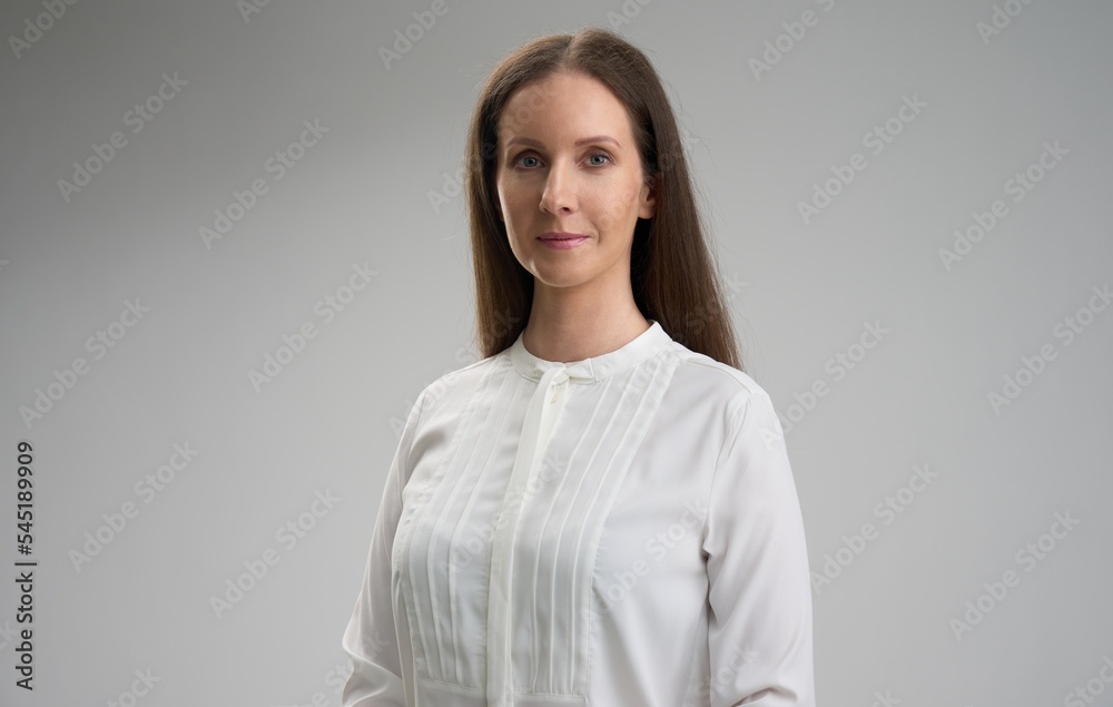 Business portrait of smiling businesswoman Young woman isolated on white. Business portrait of smiling businesswoman Young woman isolated on white.