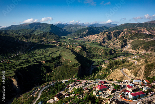 Gorol Gunib, high in the mountains, against the backdrop of green mountains, many houses against the backdrop. photo