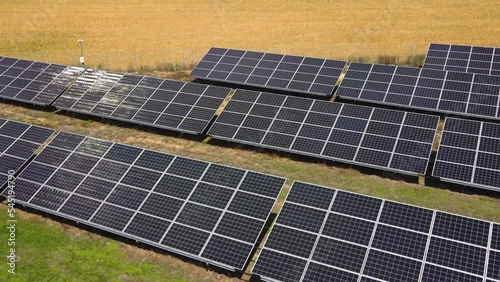 Aerial view, massive Solar panel farm on the field, alternative energy