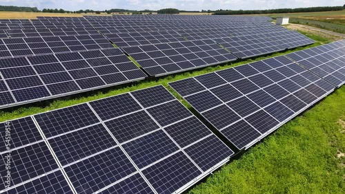 Aerial view, massive Solar panel farm on the field, alternative energy