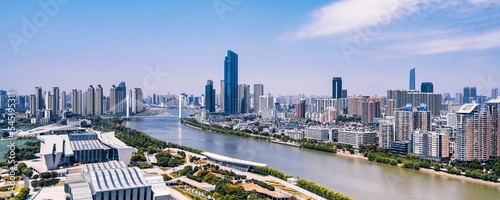 Sunny day scenery of Qintai Grand Theater and Han River in Wuhan, Hubei, China