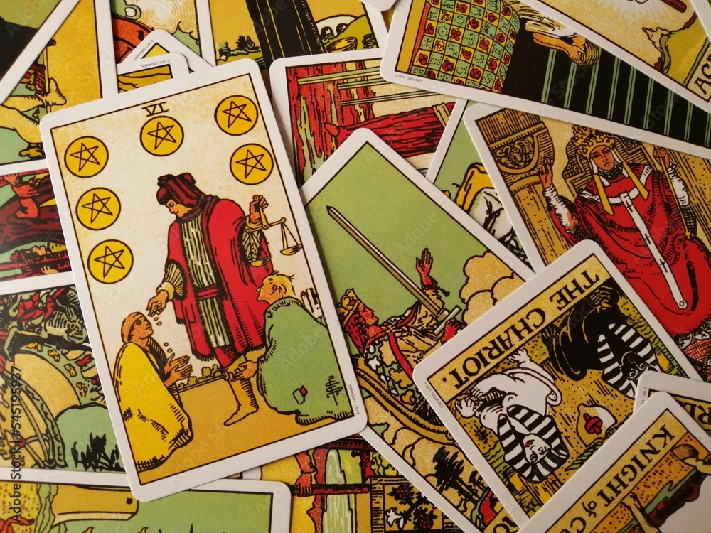 Picture of the Six of Pentacles tarot card from the original Rider