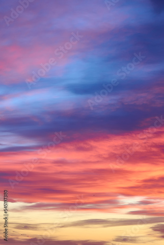 Fototapeta Naklejka Na Ścianę i Meble -  Sunset with sun and clouds on blue and orange dramatic sky.