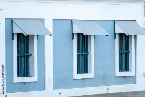 Rectangular windows of an old vintage French era building in the town of Pondicherry in South India.