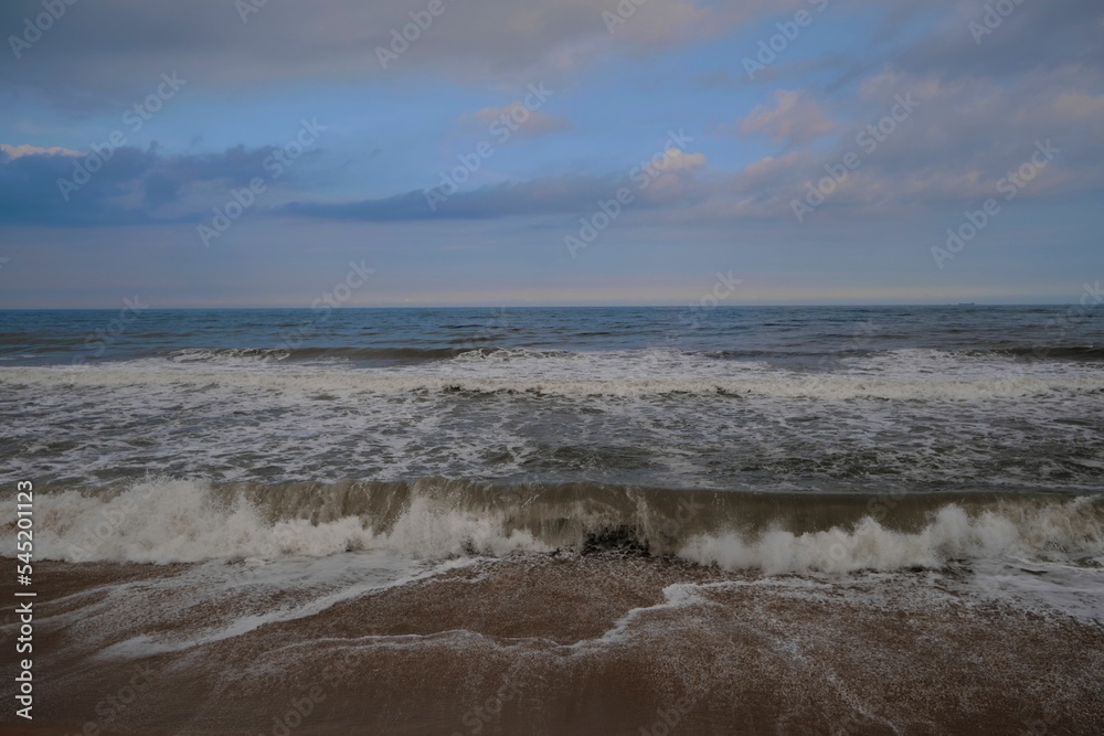 Beautiful view of a sea with small waves during sunset Beautiful view of a sea with small waves during sunset