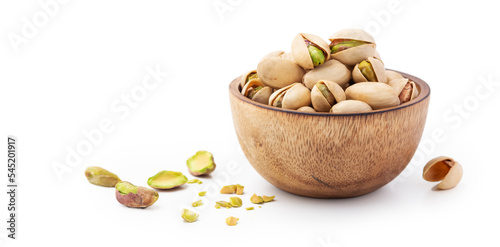 Pistachio in wood bowl on white background