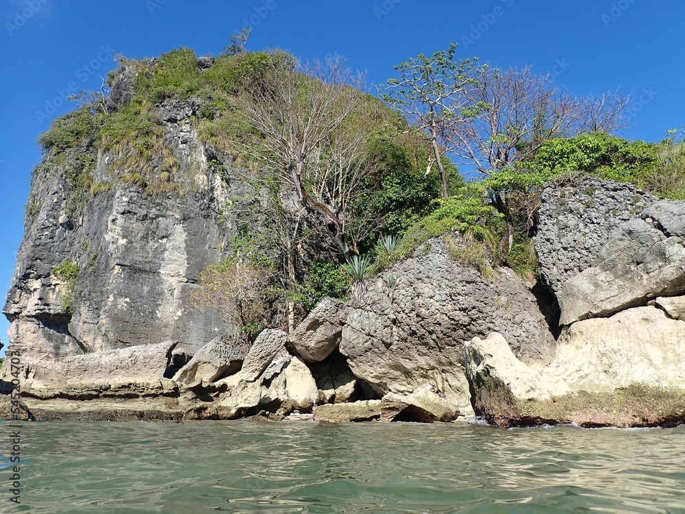 Landscape view of huge rocky cliff in Paradise Beach in Malpais, Costa Rica