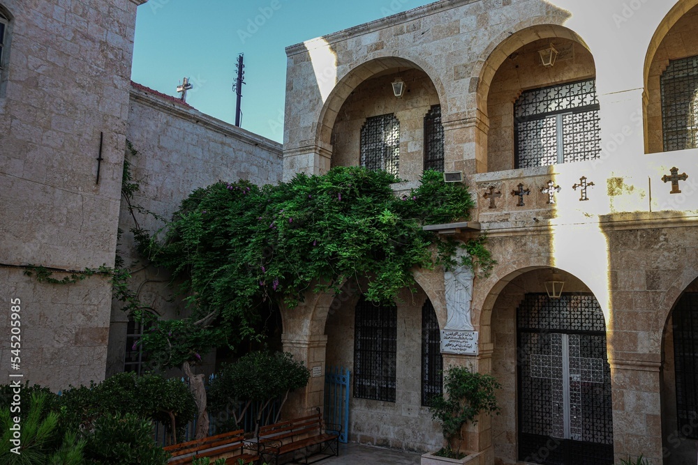 Exterior of the Convent of Our Lady monastery with greenery in Saidnaya, Damascus, Syria Exterior of the Convent of Our Lady monastery with greenery in Saidnaya, Damascus, Syria